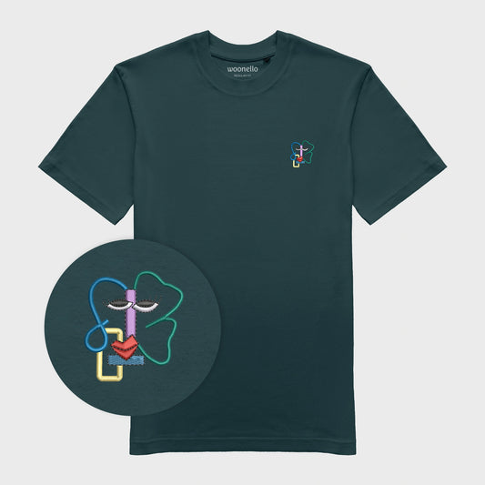 Unisex amalfi teal T-shirt with embroidered chest design, focus on design, abstract line-art face with colorful details