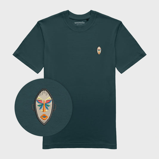 Unisex amalfi teal T-shirt with embroidered chest design, focus on design, African mask with symmetrical facial features and geometric shapes