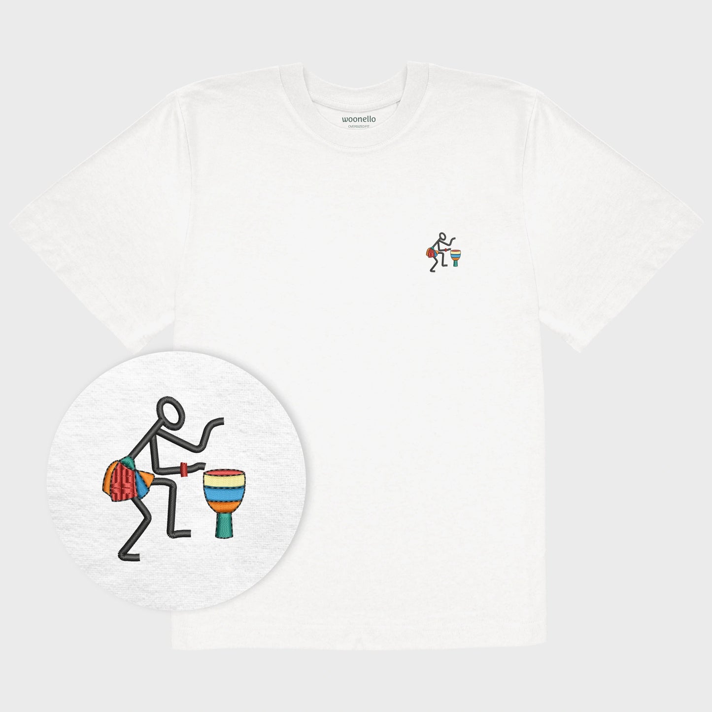 Unisex oversize white T-shirt with embroidered chest design, focus on design, Abstract African musician playing a drum