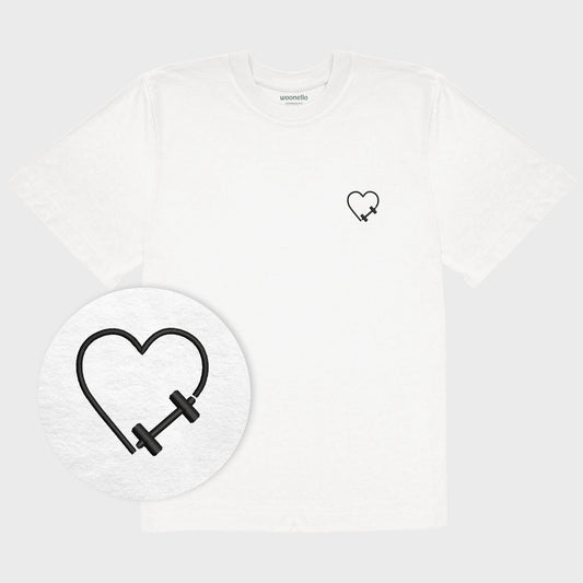 Unisex oversize white T-shirt with embroidered chest design, focus on design, dumbbell heart motif