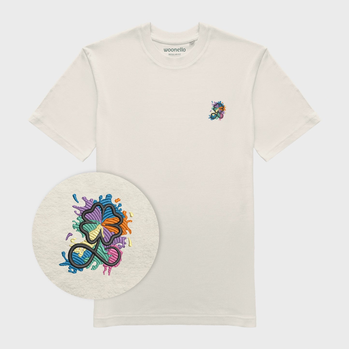 Unisex-T-Shirt cremeweiß mit bestickter Brustpartie, Fokus auf Design, Kleeblatt-Infinity-Logo im mehrfarbigen Farbspritzer-Design