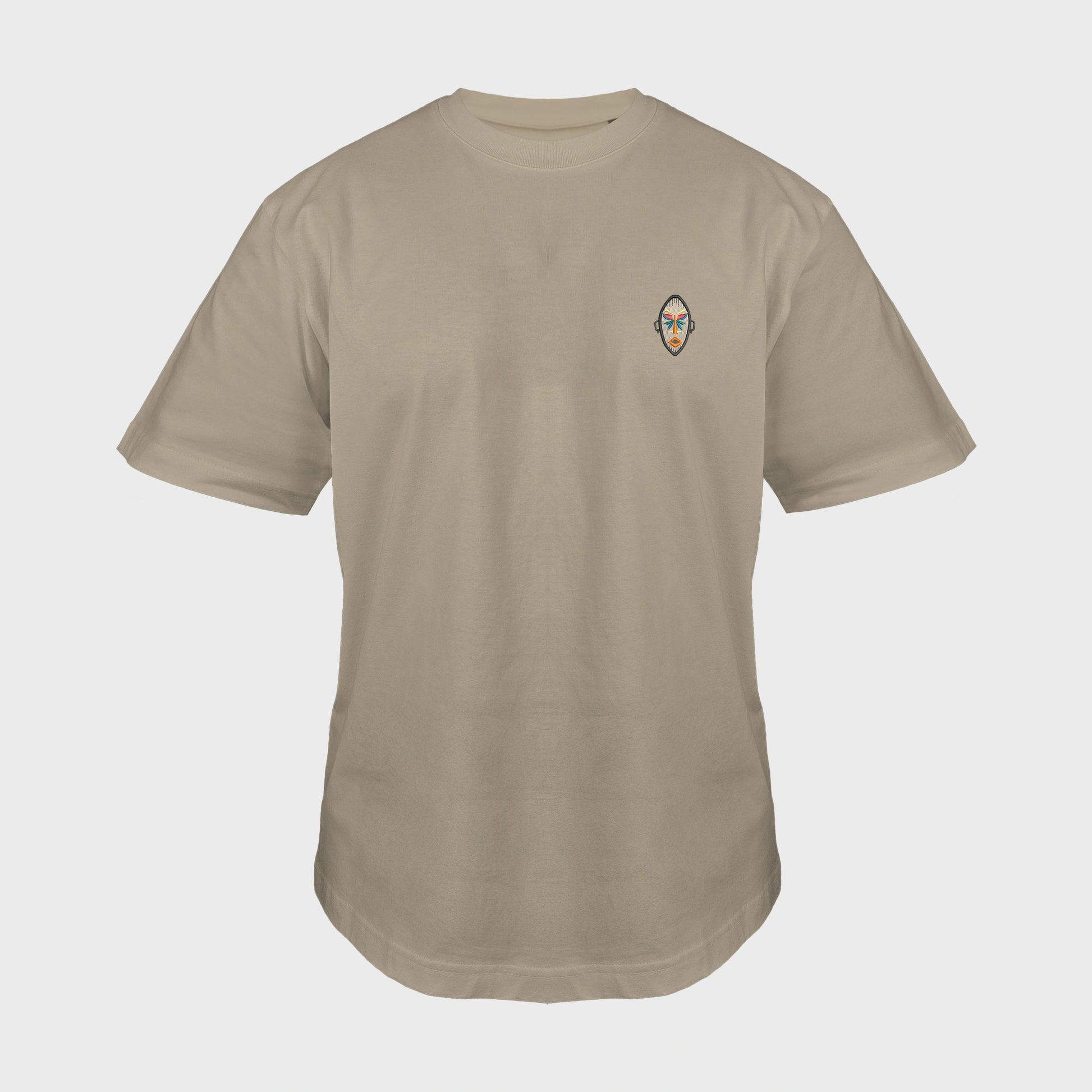 Unisex oversize mastic T-shirt with embroidered chest design, African mask with symmetrical facial features and geometric shapes, front view man