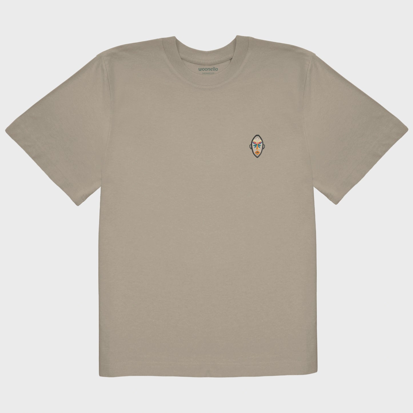 Unisex oversize mastic T-shirt with embroidered chest design, African mask with symmetrical facial features and geometric shapes